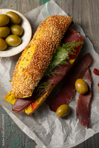 Obraz na płótnie Burger with ciabatta with turmeric and bastrum, top view w salonie