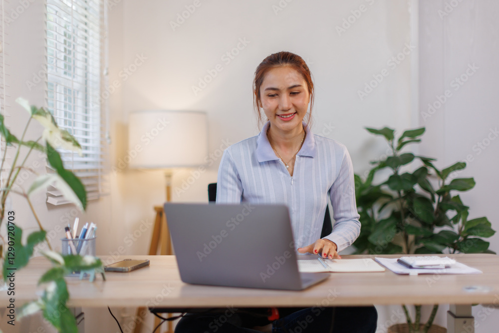 Smiling Young asian woman Using Laptop And Taking Notes While Sitting At Desk At Home, Smiling asian female Enjoying Remote Education And Distance Learning, Free Space
Smiling Young asian woman Using Laptop And Taking Notes While Sitting At Desk At Home, Smiling asian female Enjoying Remote Education And Distance Learning, Free Space
