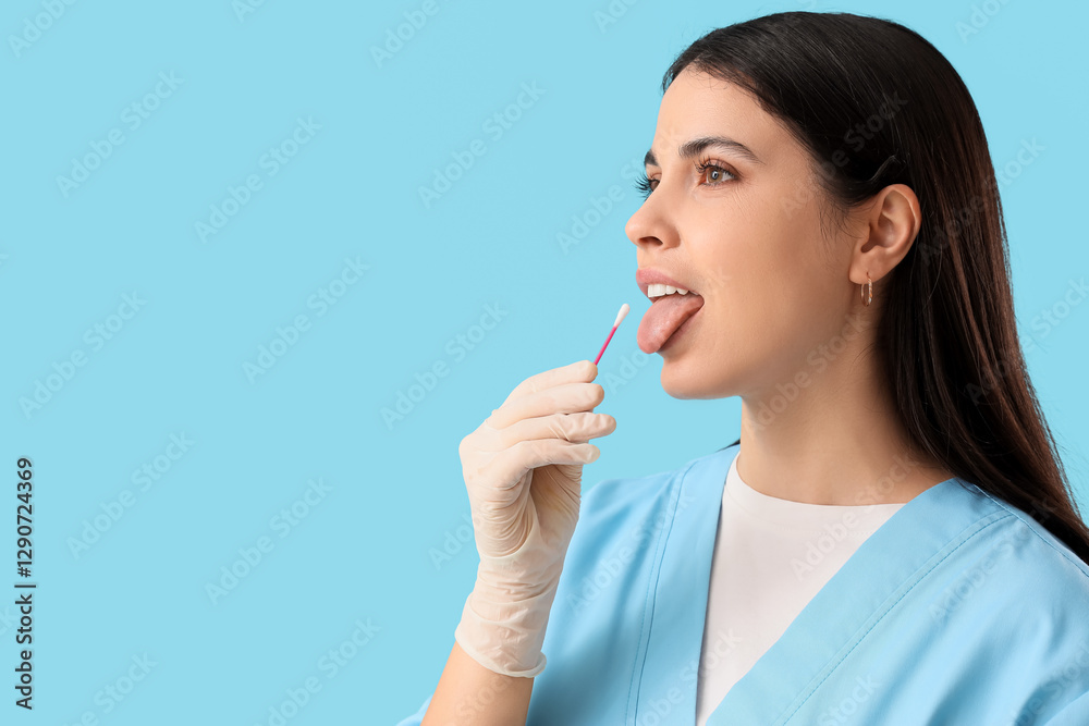 Female doctor with cotton bud on blue background, closeup Female doctor with cotton bud on blue background, closeup