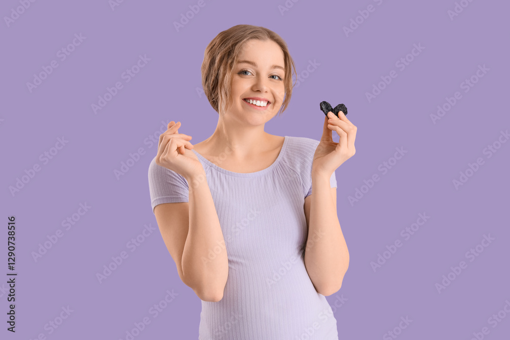 Young pregnant woman with dried prunes on lilac background Young pregnant woman with dried prunes on lilac background