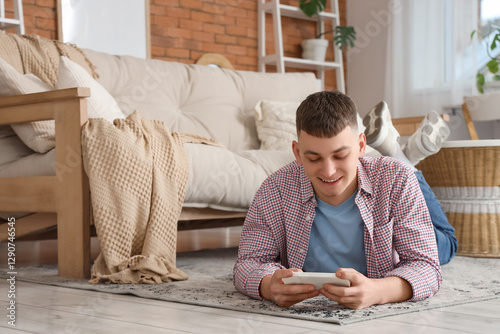 Young man using mobile phon...