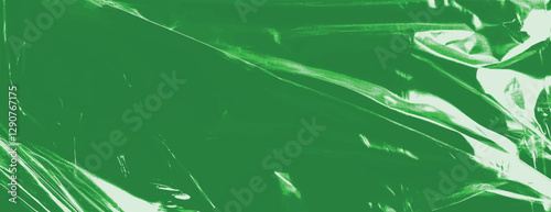 Abstract green background with a glossy, plastic-like texture. The green background features smooth, reflective surfaces. Plastic foil wrap texture background. Green background vector.