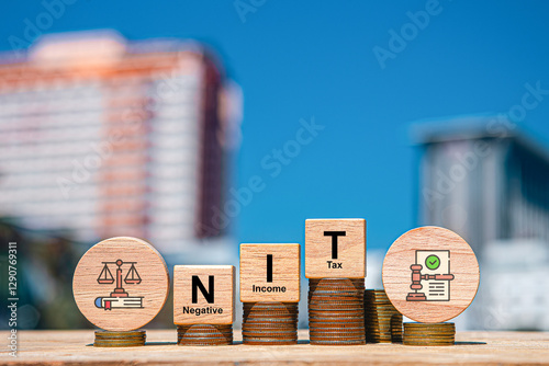 NIT Wooden blocks with words 'NEGATIVE INCOME TAX'. Business concept photo