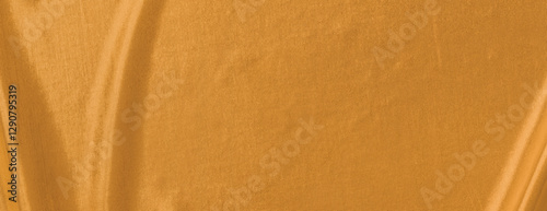 Golden background with a smooth, silky texture. The background is rich in golden hues, creating a luxurious and elegant feel. Minimal abstract flow line vector gradient background