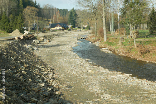 Flood reclamation river Jesenik gravel riverbed water restoration revitalization after house destroyed swept new Cerna Opava regulation flooded damaged height asphalt stone wall road building Europe photo