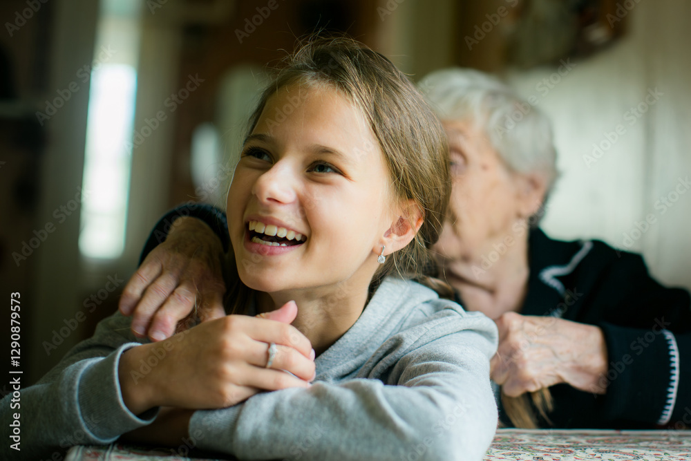 A teenage girl and her grandmother enjoying a fun and cheerful moment together.