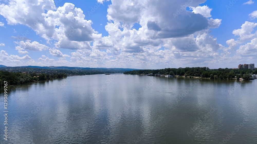 blue sky with white clouds reflected in y=the Danube river in Novi Sad blue sky with white clouds reflected in y=the Danube river in Novi Sad