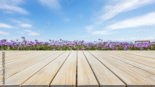 Wooden Planks Tabletop Against Purple Flowers Field Under Blue Sky