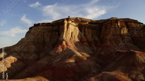 Aerial drone footage of Tsagaan Suvarga, Mongolia's Mars-like landscapes, showcasing stunning cliffs and desert terrain glowing at sunset.