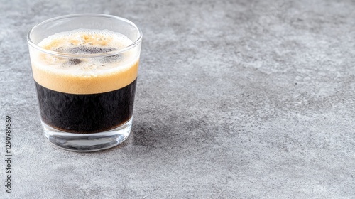 Glass of Espresso on Gray Surface photo