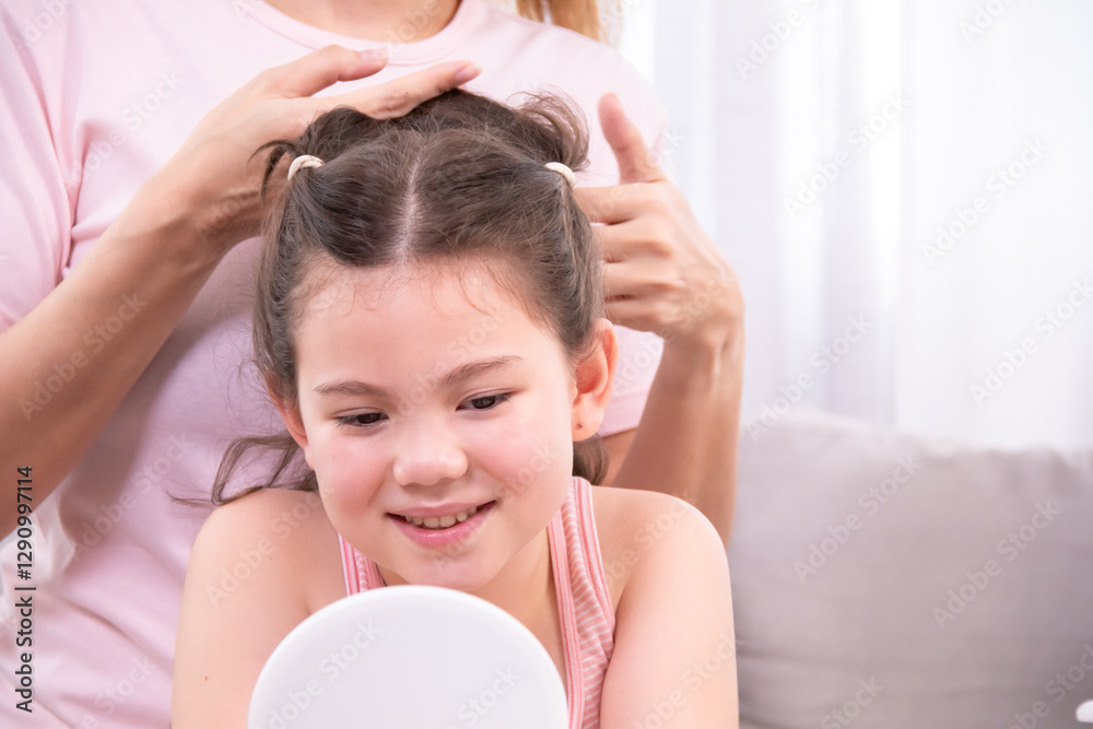 Naklejka premium Mother gently styles daughter hair while girl admires herself in mirror, woman brushes daughter's hair in a peaceful home environment, affectionate bond of parenting, embodies love, and family warmth.