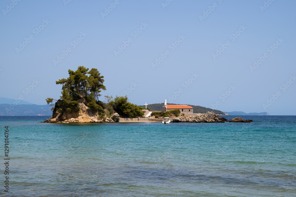 The beautiful island of Agios Nikolaos, with the small church, in Ellinika beach, North Evia, Greece