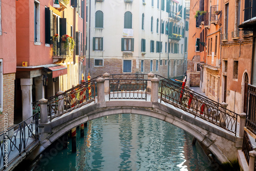 Romantic canal with small bridge in Venice 