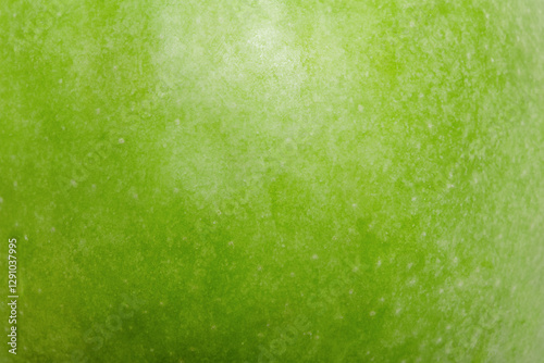 Green apple texture as a macro photo background.