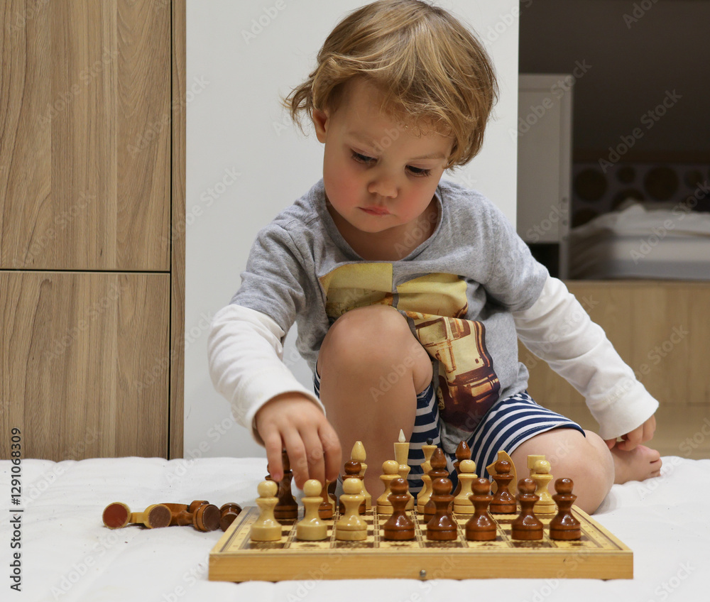 child plays chess