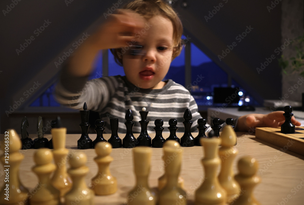 child plays chess