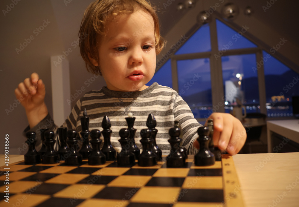 child plays chess