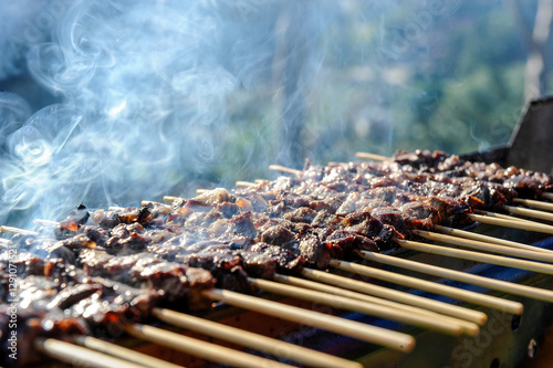 Arrosticini di pecora or sheep skewers is a typical food of Abruzzo in Italy cooked on Furnacella characteristic brazier for their cooking