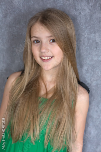 portrait of a beautiful blonde girl with big brown eyes a smiling