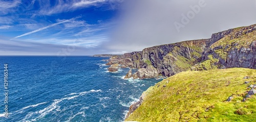 Breathtaking view of the Cliffs of Moher overlooking the Atlantic Ocean in Ireland