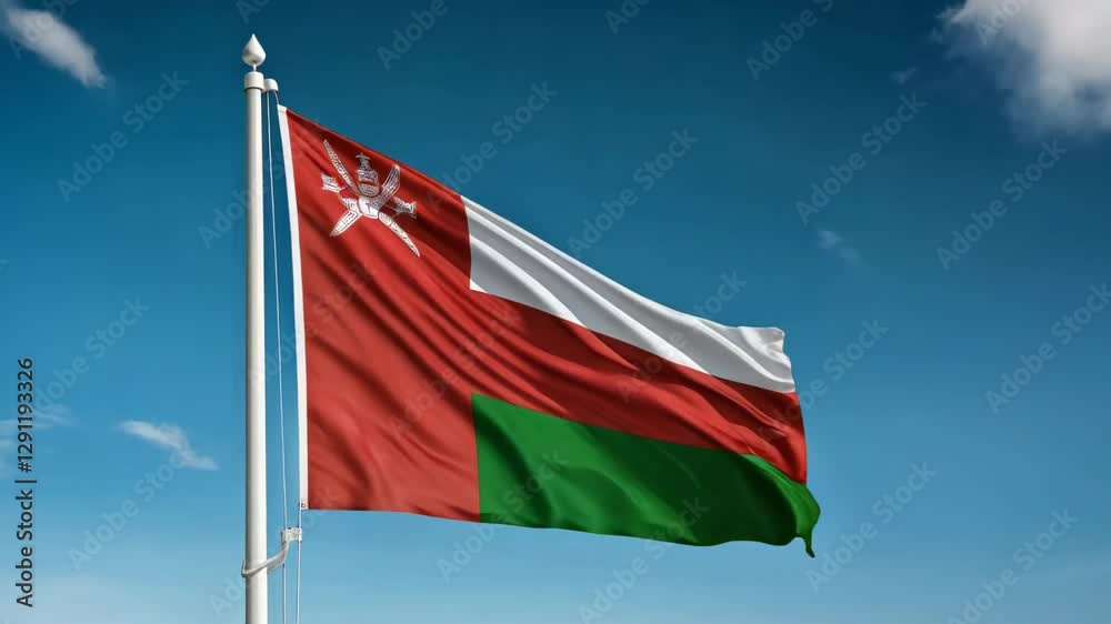 national flag of Oman waving on blue sky, banner on the wind