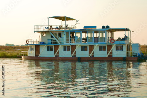 cruise ship on Kwando River, Botswana. Shortly before sunset photo