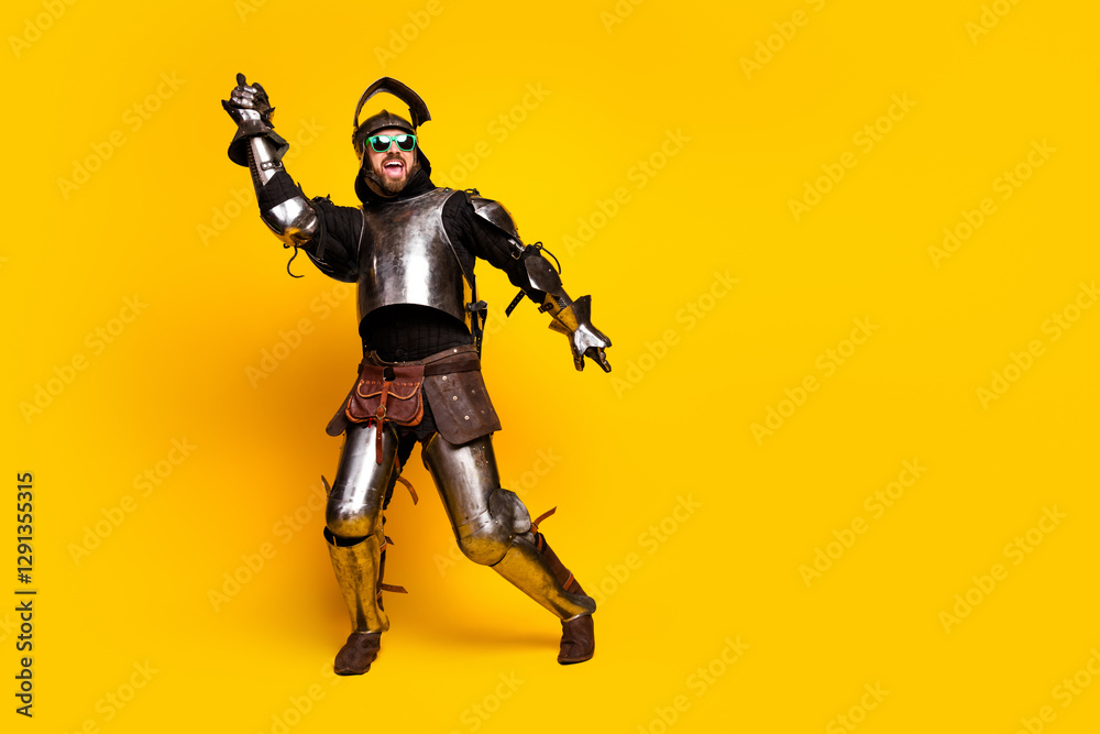 Young man in medieval armor with modern glasses on yellow backdrop displaying contrast of eras and vibrant energy Young man in medieval armor with modern glasses on yellow backdrop displaying contrast of eras and vibrant energy