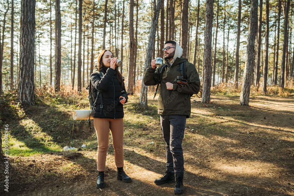 Young caucasian couple boyfriend and girlfriend hike or trek through the forest
Young caucasian couple boyfriend and girlfriend hike or trek through the forest