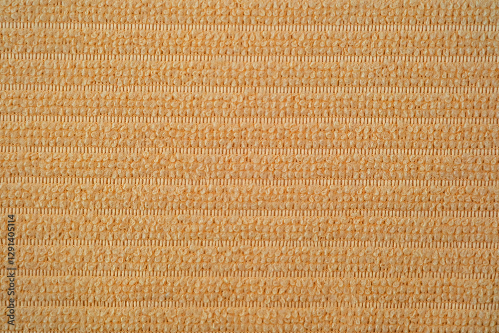 Textile close up of light orange fabric, fabric texture as a background. Textile close up of light orange fabric, fabric texture as a background.