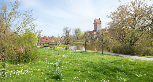 park landscape Dinkelsbuhl, historic old town with water moat, springtime middle franconia photo