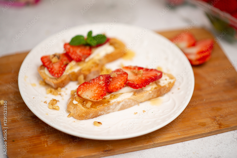 Bruschetta with strawberries. fried in batter toast with cream cheese Bruschetta with strawberries. fried in batter toast with cream cheese
