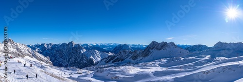 Stunning panorama view of snow covered peaks of Austrian Alps in Tyrol from Zugspitzplatt on a sunny day in winter, Garmisch-Partenkirchen, Bavaria, Germany