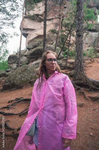 Woman in the taiga forest a...