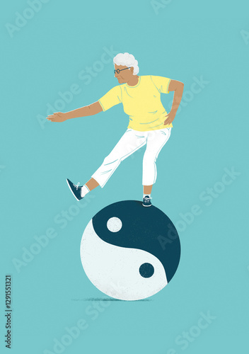 A happy senior woman balancing on a yin yang ball symbol
