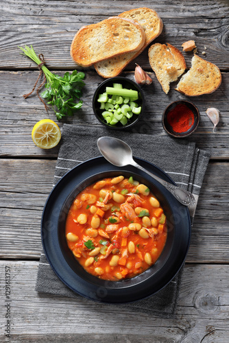 Pasulj, white bean soup with chicken in bowl photo