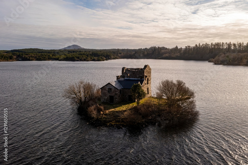 Ballynahinch Castle in the centre of the Lake at the golden hour. Connemara, Galway. photo