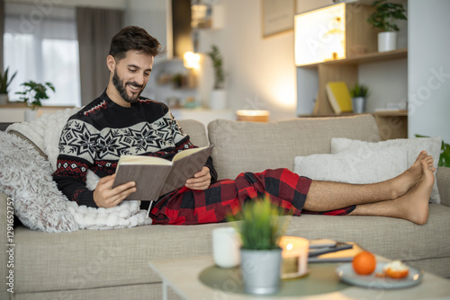 Cozy evening with a book in a modern living room enjoying relaxation time at home