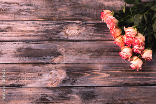 pink roses on the wooden background