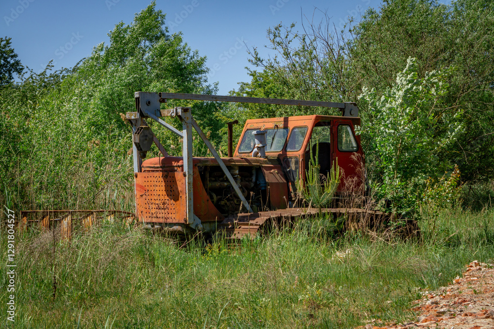 devastated and destroyed bulldozer, lift, crane on the premises of an abandoned production company devastated and destroyed bulldozer, lift, crane on the premises of an abandoned production company