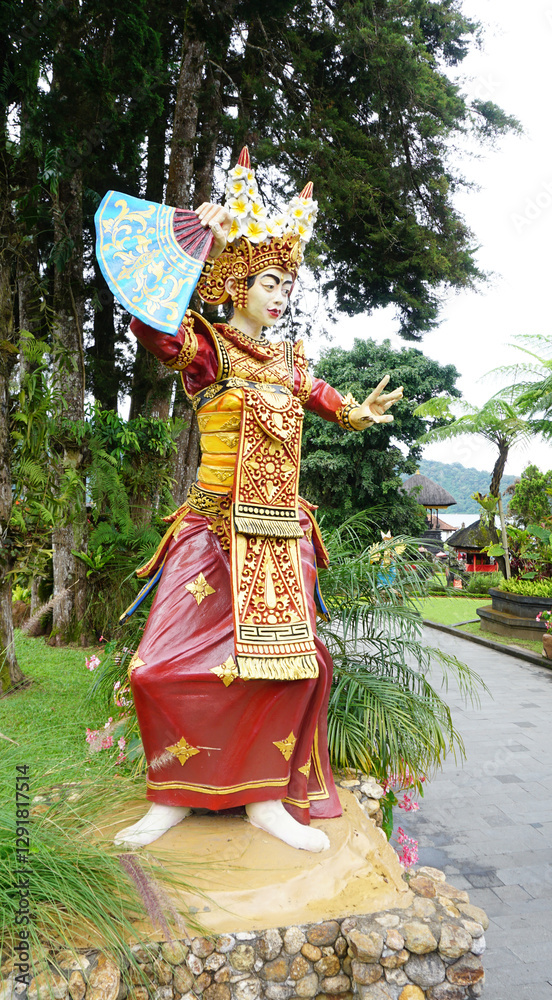 A colorful statue beautifully showcasing traditional dance attire in Ulun Danu Beratan Temple