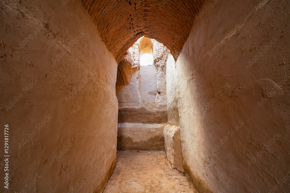 Obraz premium Vaulted hallway in the Qirqqiz Fortress, the first Islamic Academy for girls located on the outskirts of Termiz in the Surxondaryo region of Uzbekistan, Central Asia