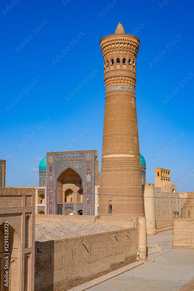 Obraz premium Aerial view of the Po-i-Kalyan complex made of the Kalan Mosque , the Kalyan Minaret and the Mir-i Arab Madrasah in the historic old town of Bukhara in Uzbekistan, Central Asia