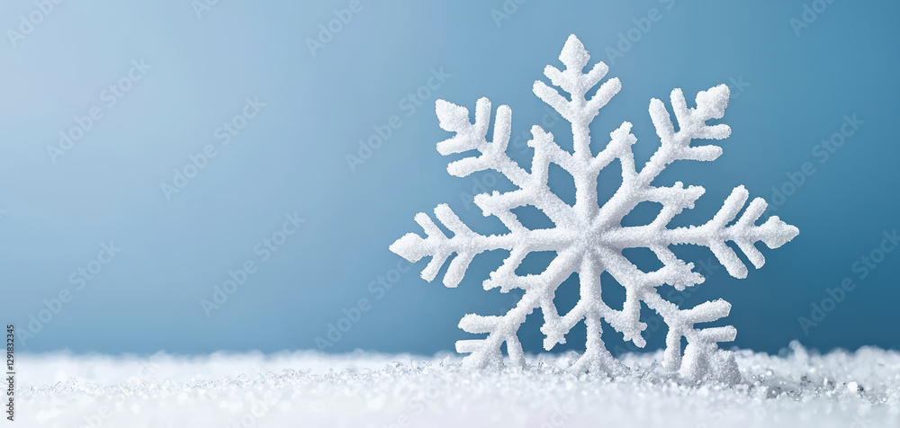 close up of snowflake on snowy surface, showcasing intricate details and serene winter atmosphere