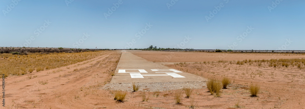 airfield runway 09 on red sand at Kalahari desert countryside, Bitterwasser, Namibia