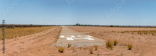 Obraz na płótnie airfield runway 09 on red sand at Kalahari desert countryside, Bitterwasser, Namibia w salonie
