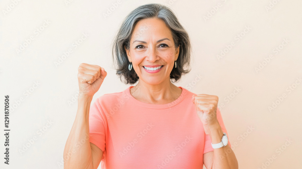 Middle aged latin american woman with raised fist of empowerment, strength and women solidarity, International Womens Day concept Middle aged latin american woman with raised fist of empowerment, strength and women solidarity, International Womens Day concept
