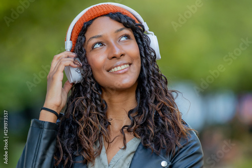 Obraz na plátně portrait of beautiful young latina woman with headphones