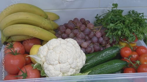 Vegetables and fruits folded in a basket