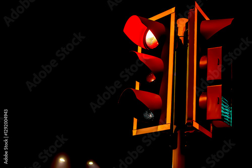 Traffic light at night at an urban intersection