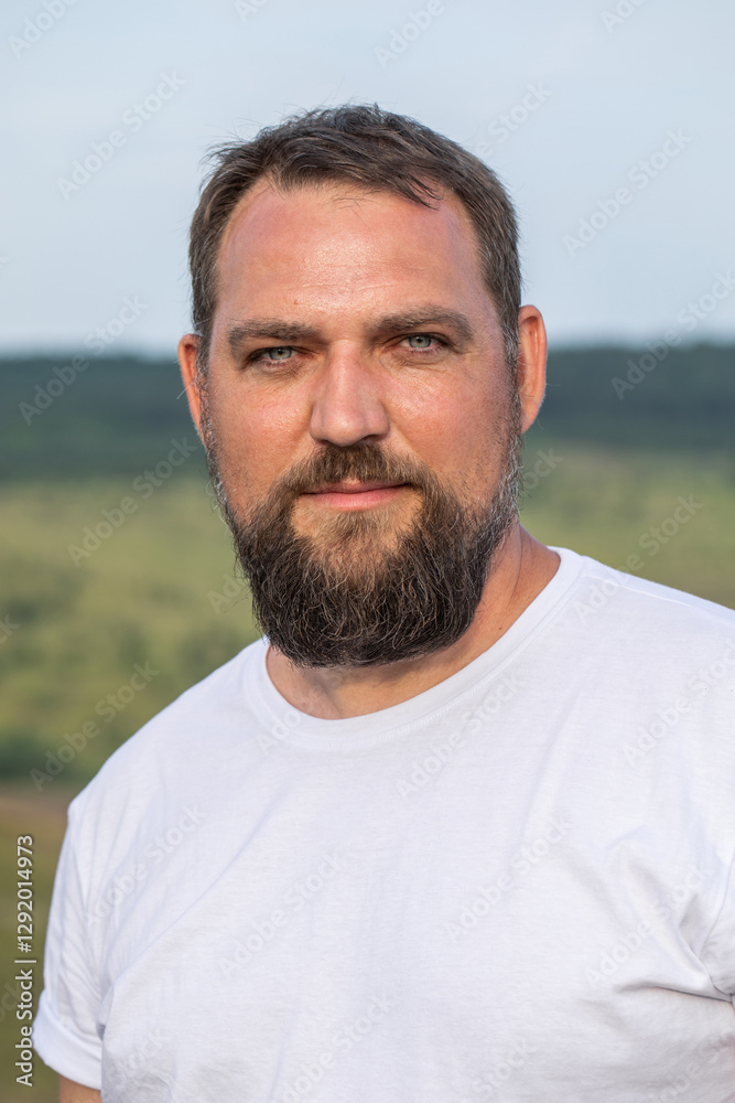 Portrait of a middle-aged brunette man with a thick beard Portrait of a middle-aged brunette man with a thick beard